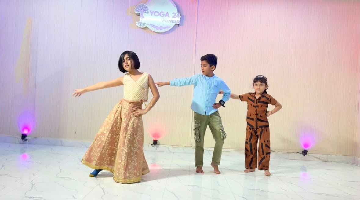 Children performing a dance routine on stage
